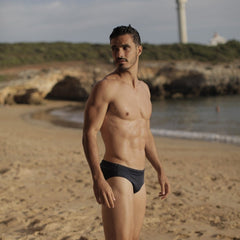 Men wearign teh TIma Swim trunk from Fourth Element